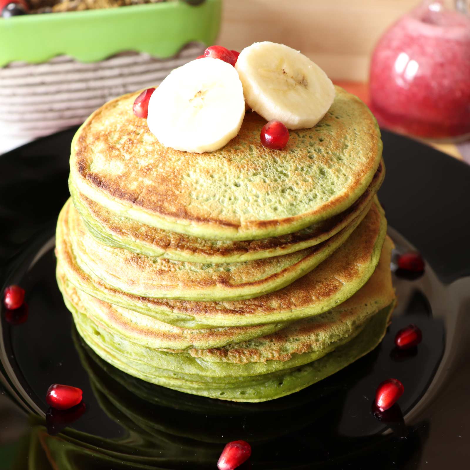 Fluffy and delicious eggless green pancakes made with spinach and banana, plant based vegan recipe for tasty pancakes