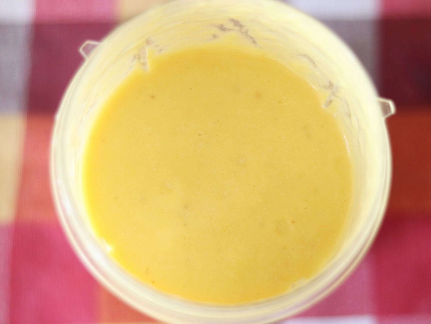 Anti-inflammatory pineapple turmeric smoothie in blender cup.