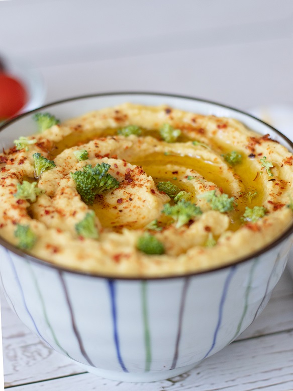 Vegan chickpeas hummus served with veggies for breakfast, dinner or as an appetizer