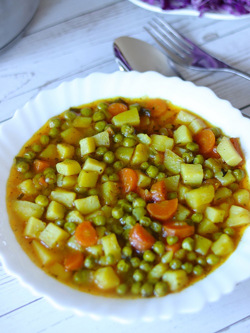 Frozen peas cooked with fresh veggies. Delicious, and hearty plate full of tasty pea stew.