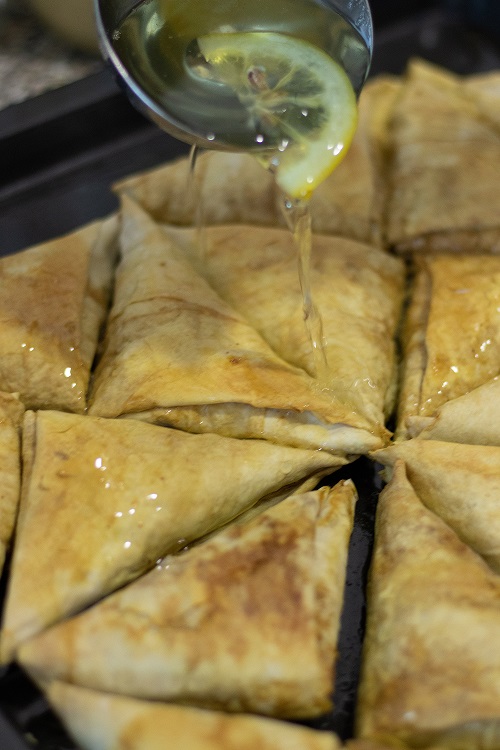 Pouring baklava syrup