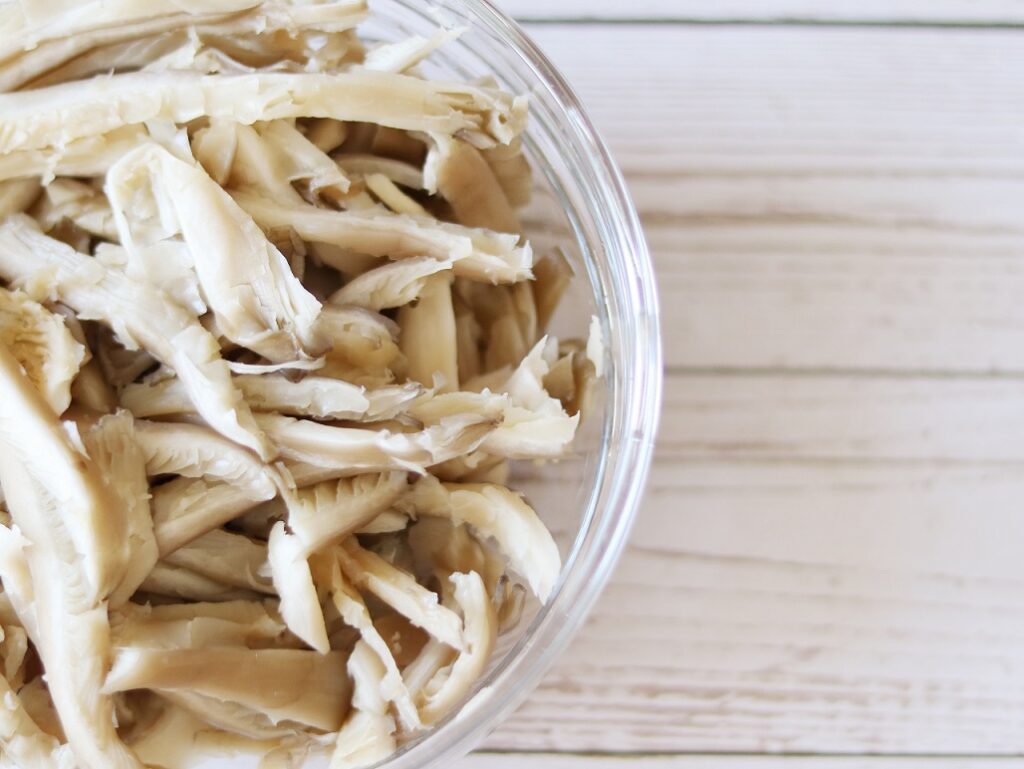 Raw oyster mushrooms in a bowl for preparing vegan dinner or lunch