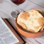 Recipe for unleavened bread for Passover Festival. Bible flatbread, homemad and easy to make with red wine and open Bible. No yeast, yeast-free bread.