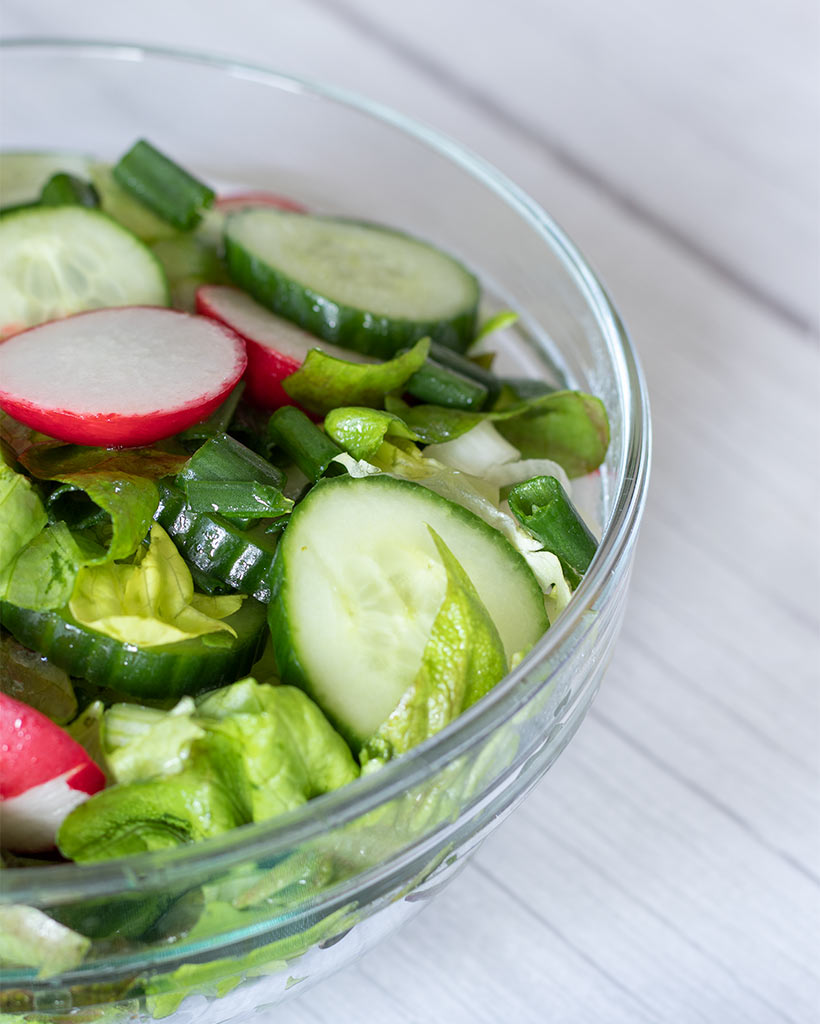 Fresh green leafy chopped salad with lemon vinaigrette