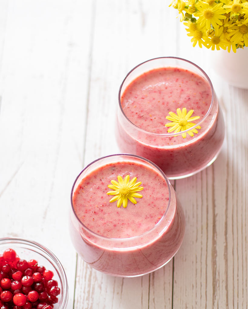 Sugar-free, dairy-free cranberry smoothie. Two glasses of vibrant pink superfood drink