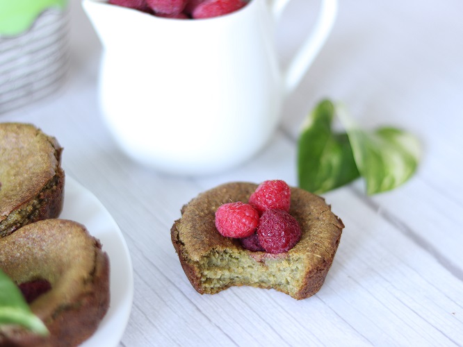 Easy spinach banana muffins recipe decorated with raspberries