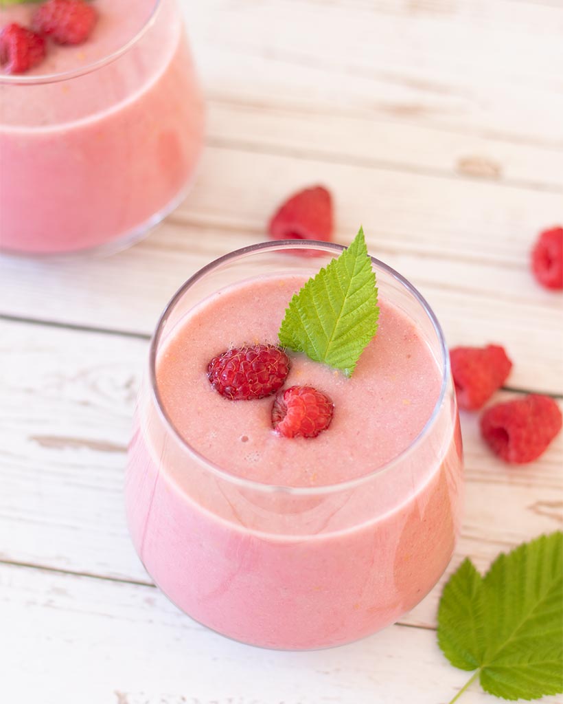 Healthy pink raspberry smoothie. Easy vegan drink for morning on-the-go breakfast or snack.