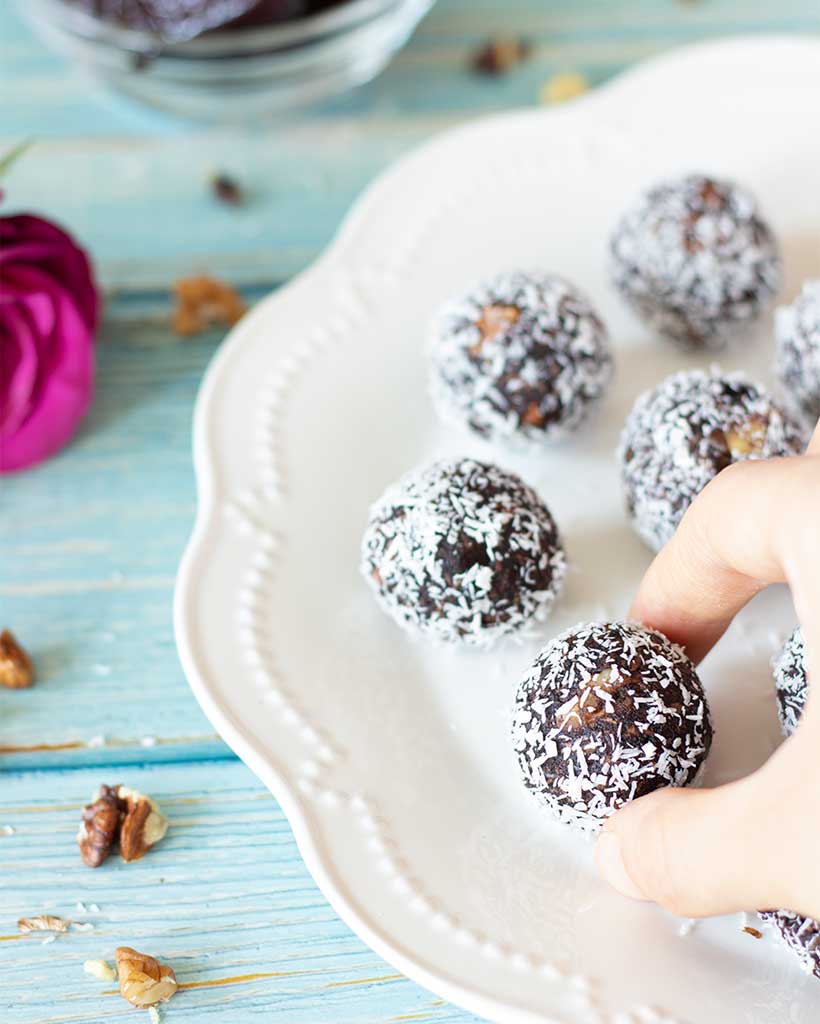 Chocolate walnut date balls with coconut.