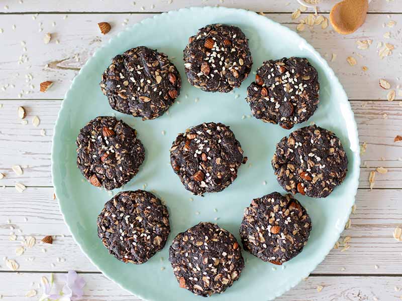 Plate full of naturally sweetened no bake tahini dessert cookies 