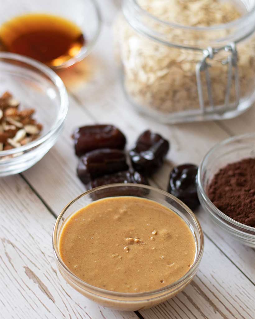 Plate full of naturally sweetened no bake tahini dessert cookies