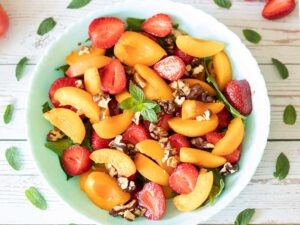 Easy summer fresh salad with apricots and strawberries