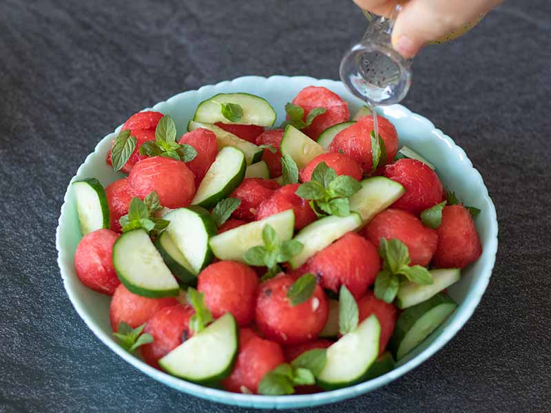 Easy Mediterranean summer salad with watermelon and cucumber with lemon-maple syrup-poppy seeds vinaigrette