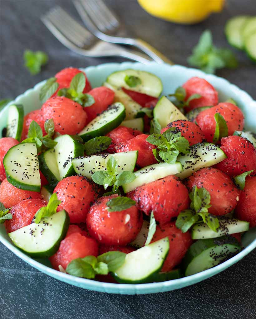 Raw watermelon salad with fresh mint and cucumber with zesty lemon-poppy seeds dressing