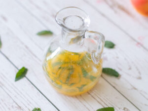 Lemon, orange and fresh mint vinaigrette dressing for fruit salad with apricots