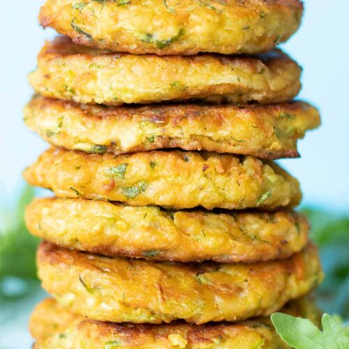 A stack of vegan gluten-free zucchini fritters with chickpea flour