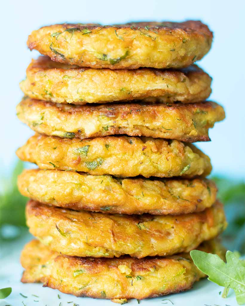 A stack of vegan gluten-free zucchini fritters with chickpea flour