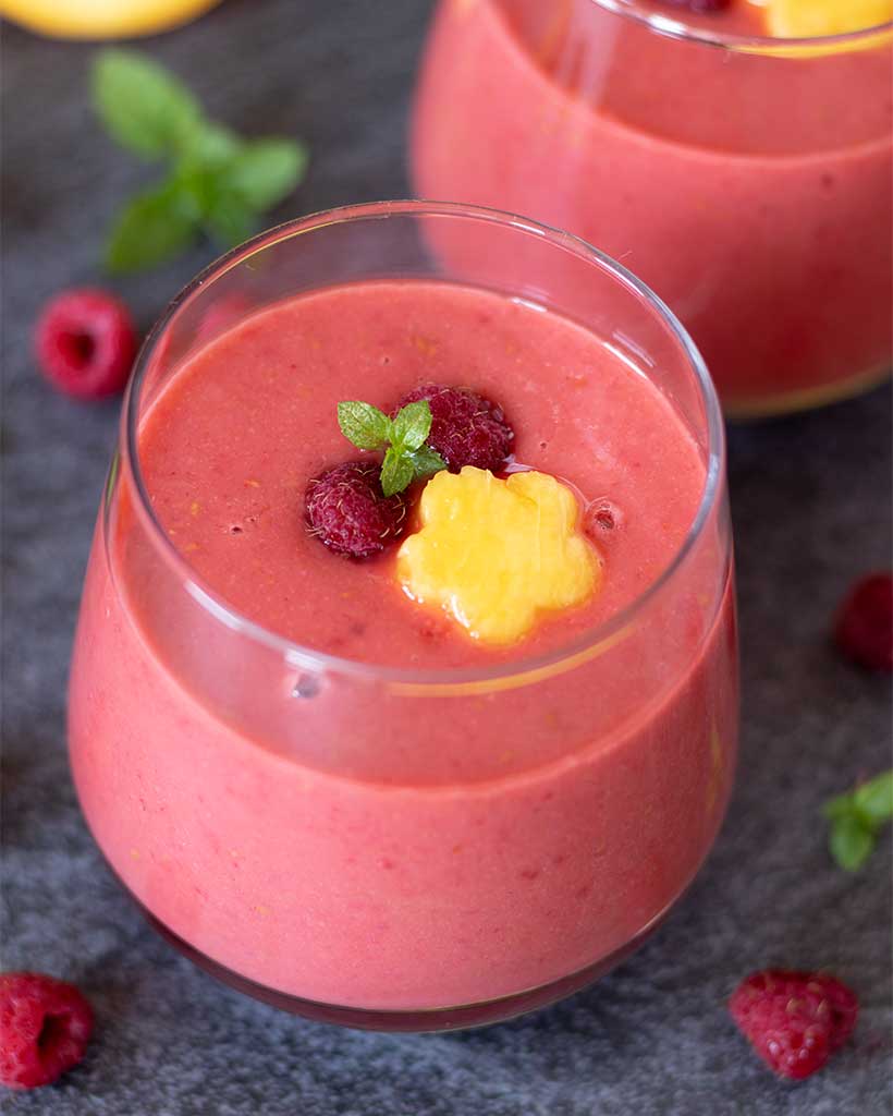 Easy recipe for peach and raspberry smoothie without yogurt. Refined sugar-free and gluten-free vegan drink with beautiful pink color.