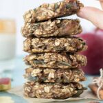 Recipe for apple oatmeal cookies for breakfast or dessert. A stack of healthy cookies with apple, banana, oats, pumpkin seeds and cinnamon.