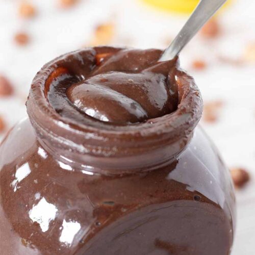 Healthy homemade Nutella with dates, hazelnuts, and cocoa powder.