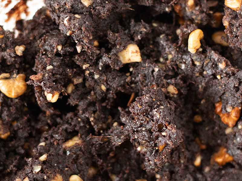 Homemade dough for easy and healthy no-cook brownies with dates and walnuts.