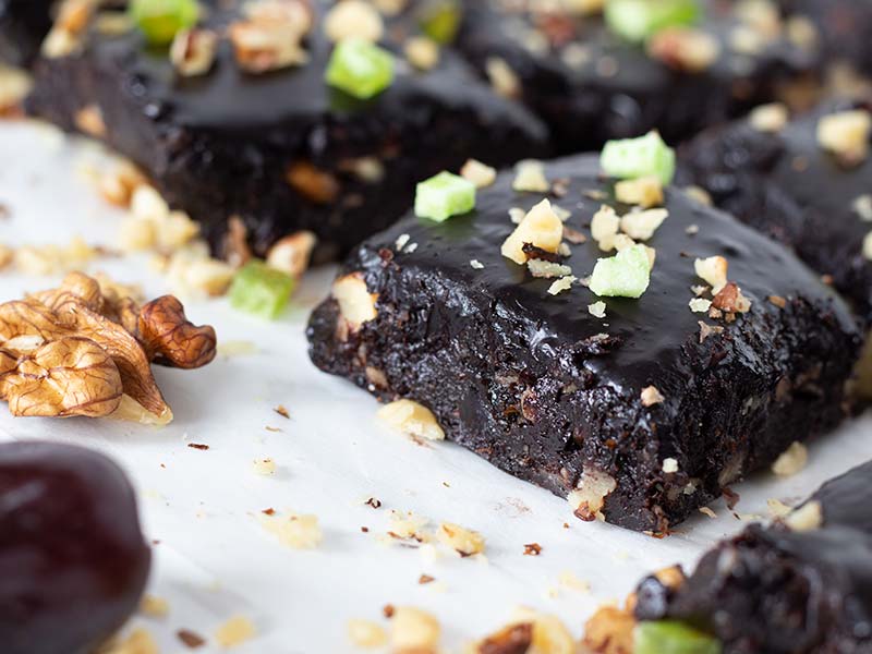 Raw sweet brownie bites with walnuts and dates