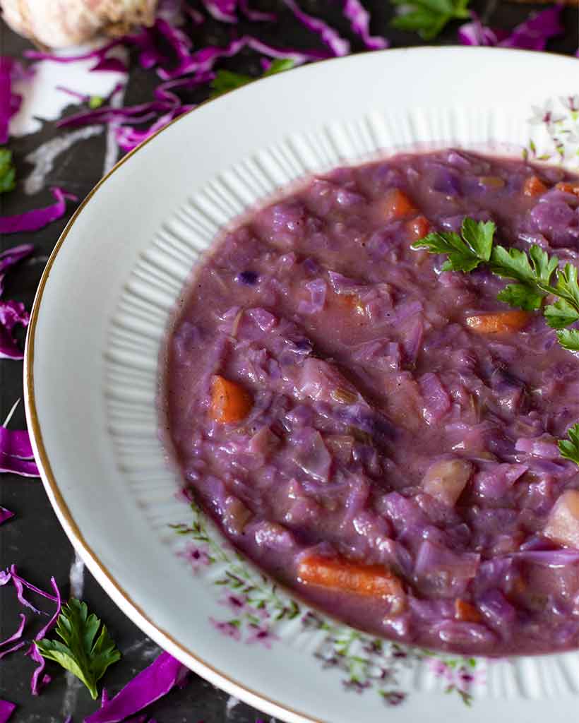 Homemade purple cleansing soup with healthy hearty vegetables with immunity and digestion boosting properties.