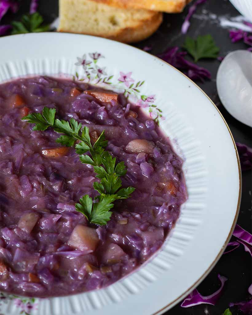 Simple red cabbage and vegetables detox soup . Easy homemade one pot vegan healthy meal.