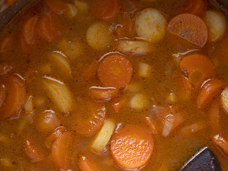 Cooking pot full of warming gluten-free immunity-boosting carrot & parsnip soup