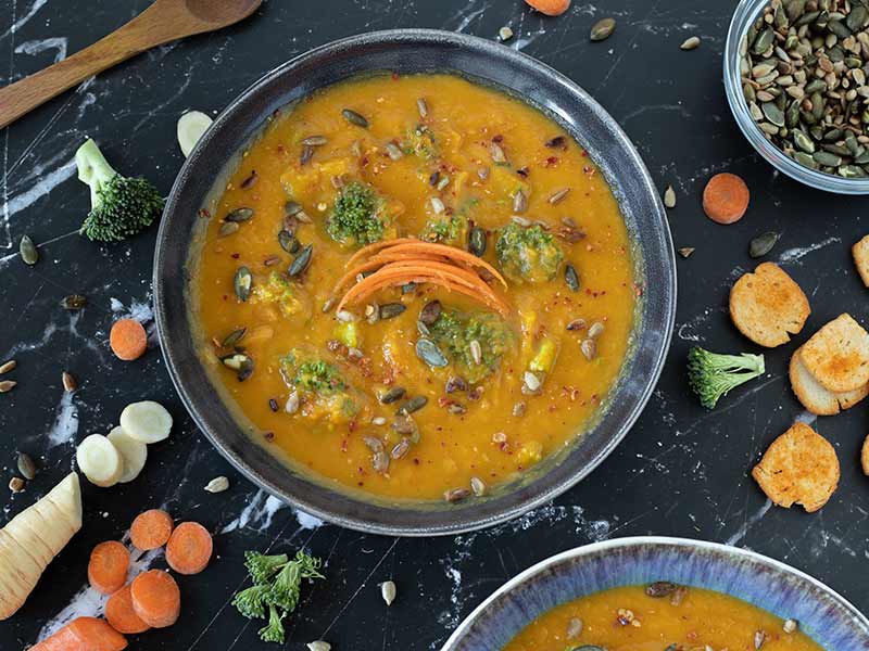 Vegan immune-boosting carrot parsnip broccoli soup without stock full of fresh wholesome ingredients for breakfast, lunch, dinner.