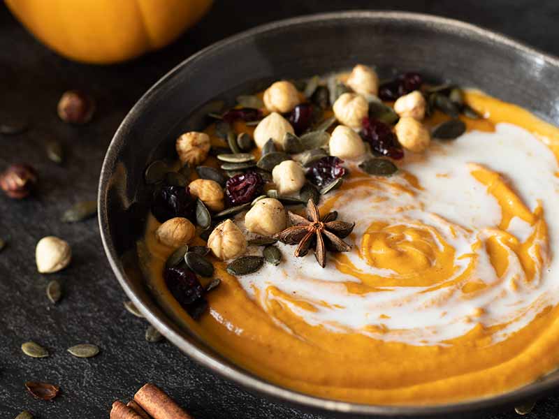 Budget-friendly, dairy-free, and gluten-free garnished with roasted hazelnuts, pepitas, dried cranberries, and star anise as a tasty side, dinner, or comfort meal.