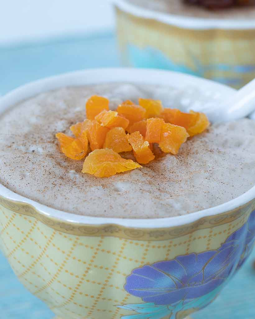 A closeup of hearty vegan rice pudding served as a warming, sweet treat.