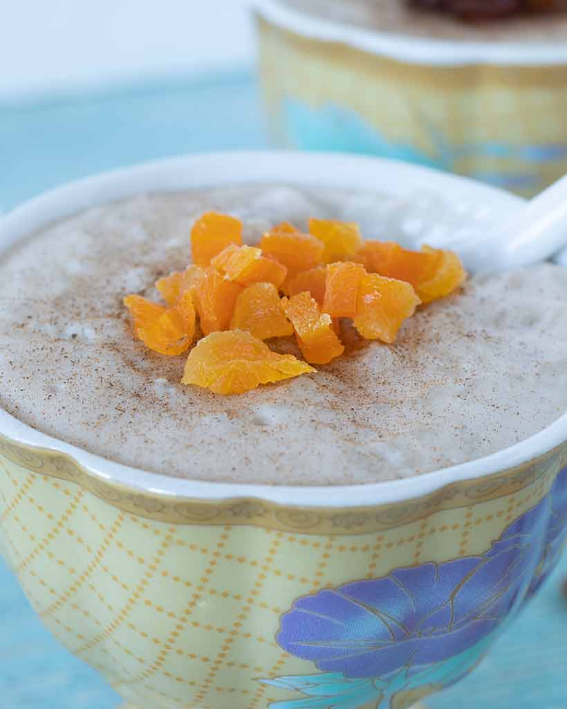 A closeup of hearty vegan rice pudding served as a warming, sweet treat.