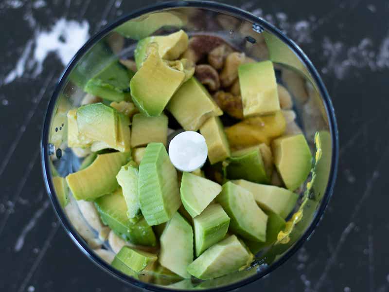 Fresh and healthy clean ingredients for preparing quick homemade avocado mayo without eggs.
