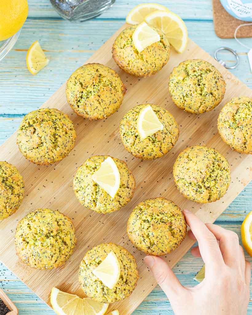 Poppy seeds lemon muffins without yogurt on a wooden cutting board. Best vegan recipe for a healthy moist vegan muffins.