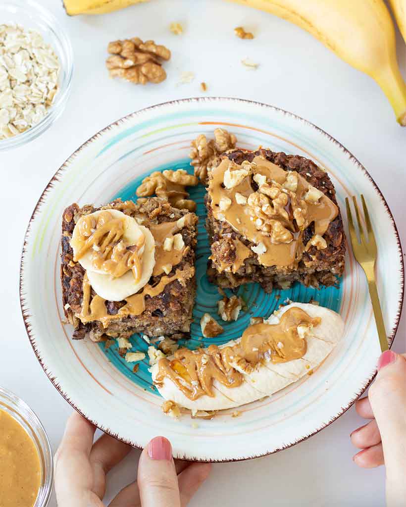 Banana baked oatmeal recipe (no sugar, no egg). Healthy vegan plant-based breakfast, snack, brunch, or dessert.