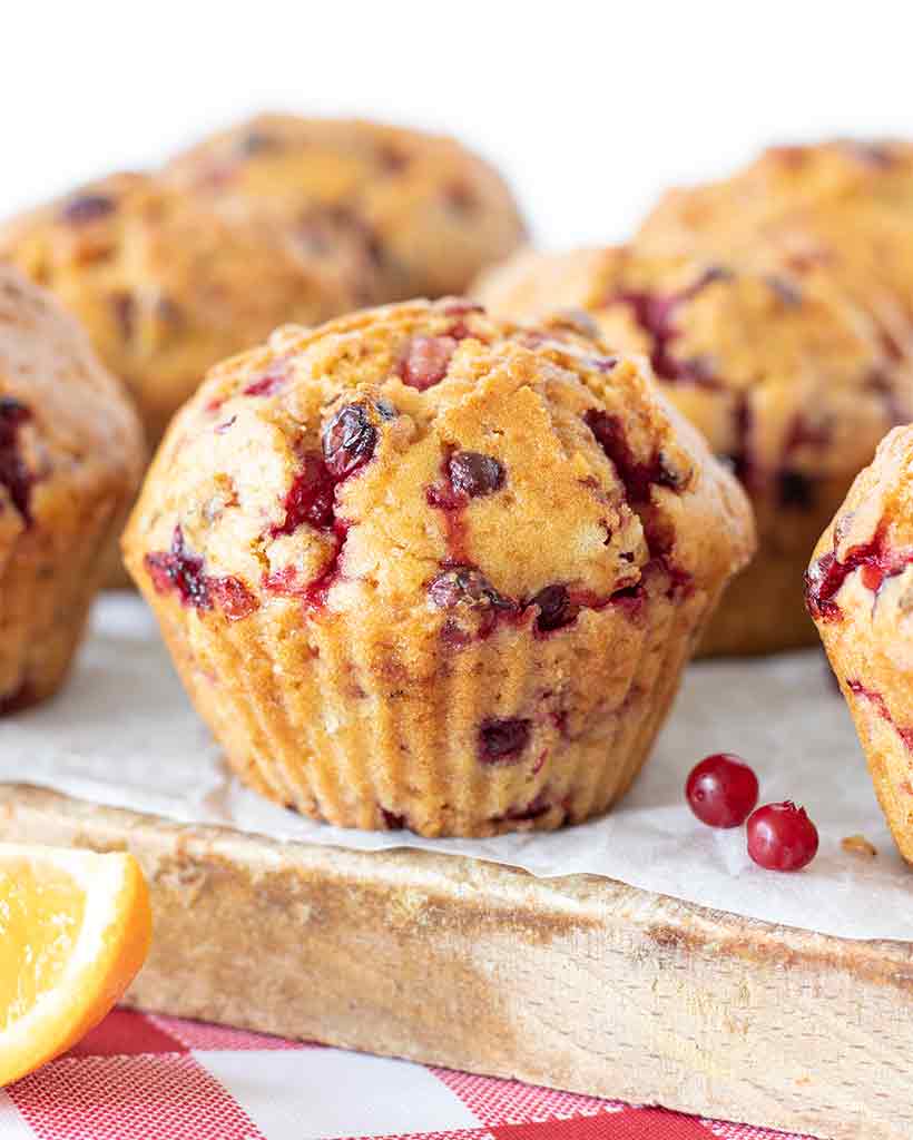 Bakery style vegan cranberry orange muffins without eggs.