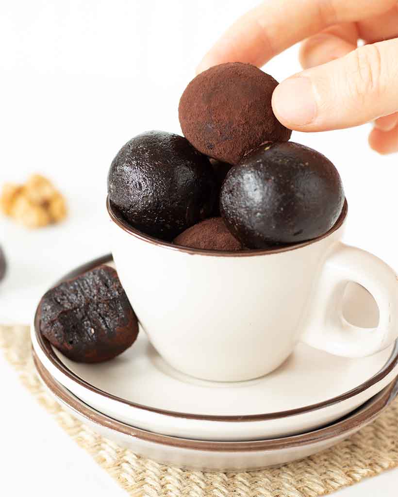 Healthy homemade chocolate date truffles with walnuts for a quick and easy no-bake dessert or snack