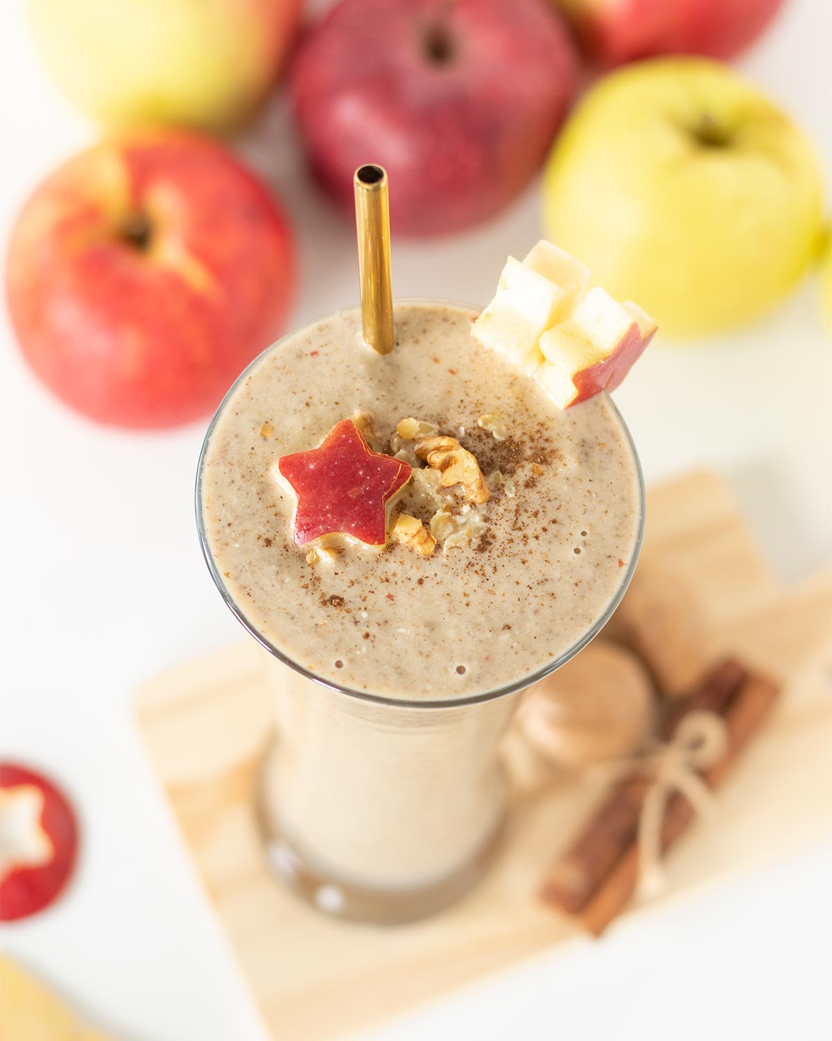 Apple peanut butter smoothie with cinnamon, dates, oats, and chia seeds for a healthy vegan protein breakfast or snack