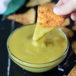 Best vegan cheese sauce without cashews in a bowl with corn chips on dark background