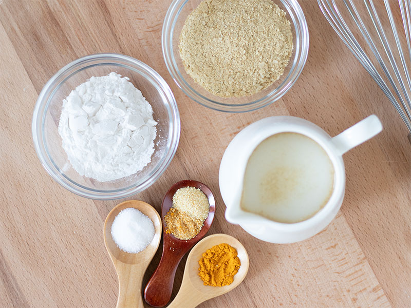 Simple plant-based ingredients for preparing the best vegan cheese spread: oat milk, tapioca flour, nutritional yeast, salt and spices
