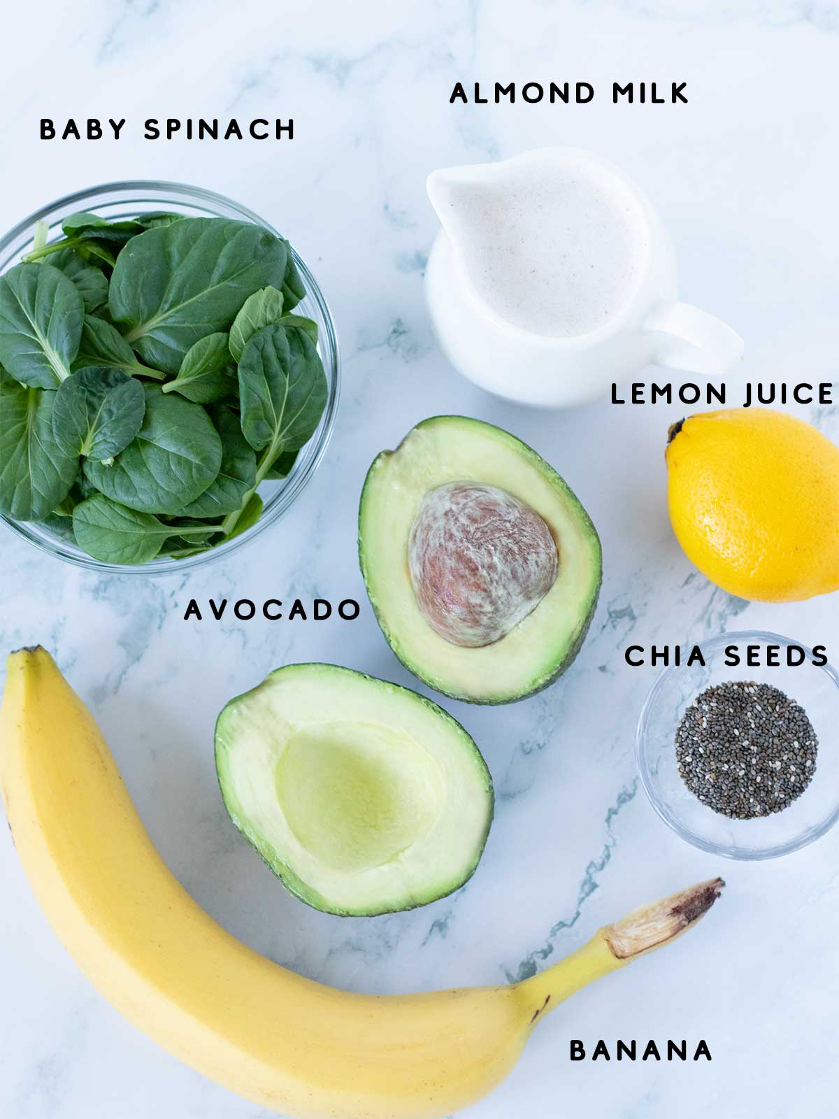 Simple plant-based ingredients for preparing avocado and banana smoothie with spinach