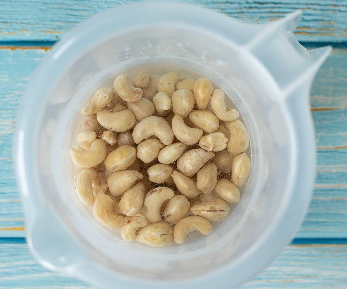 Cashews soaking in water in a bowl