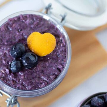 Blueberry lemon overnight oats with vibrant purple color in a jar