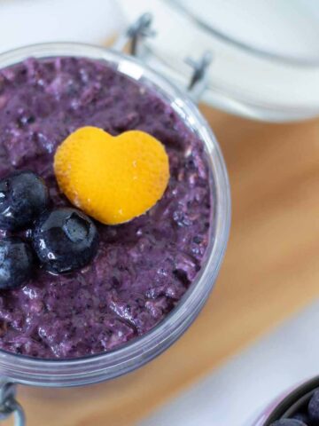 Blueberry lemon overnight oats with vibrant purple color in a jar