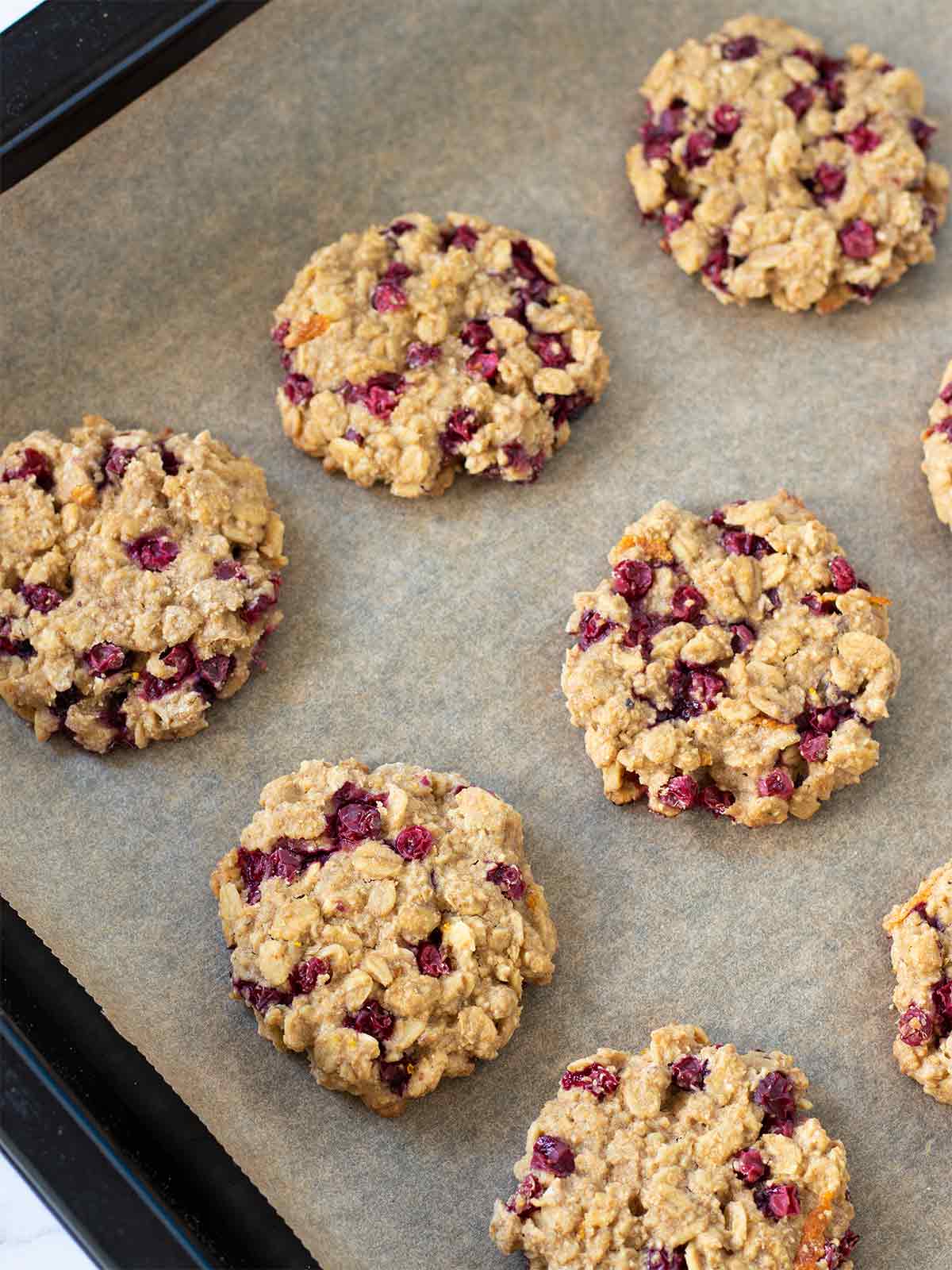 Freshly baked cranberry orange cookies in a baking pan