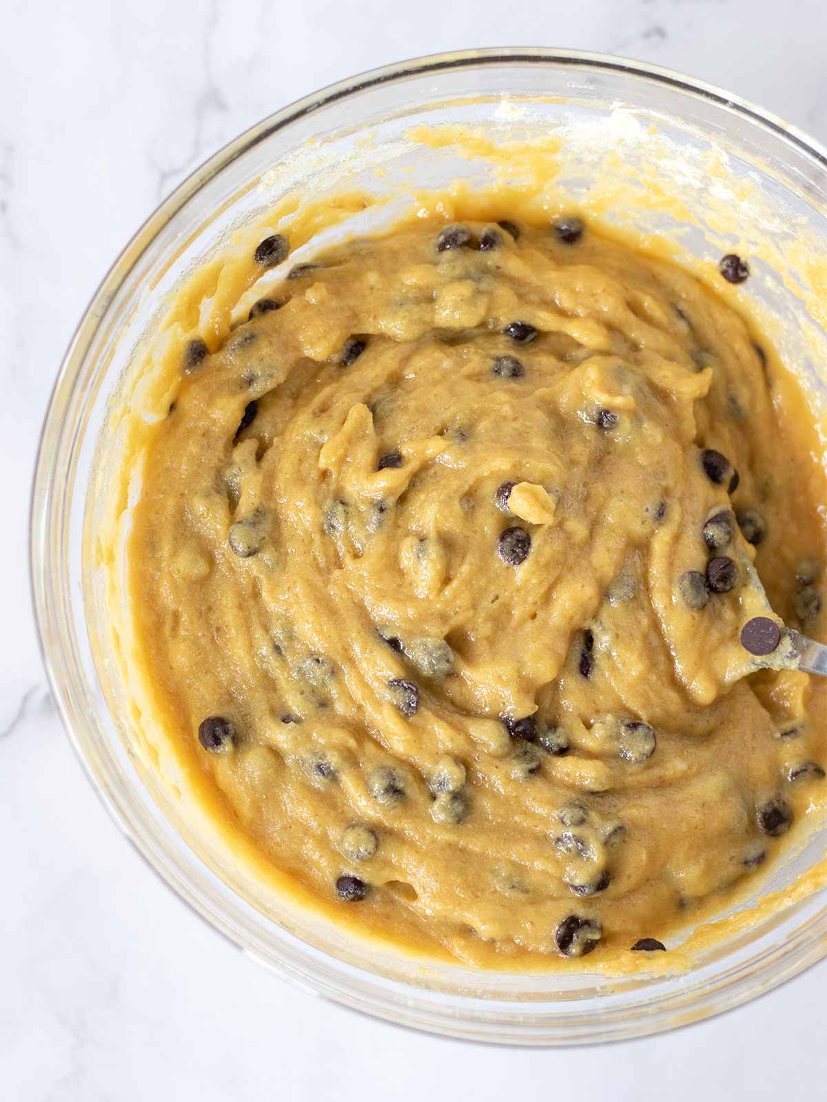 Healthy vegan cookie dough with dairy-free chocolate chips in a bowl