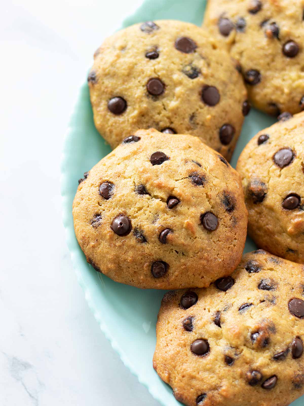 Eggless chickpea flour banana cookies with chocolate chips on a plate
