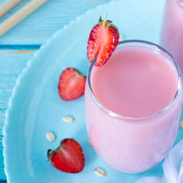 Homemade strawberry oat milk in a glass