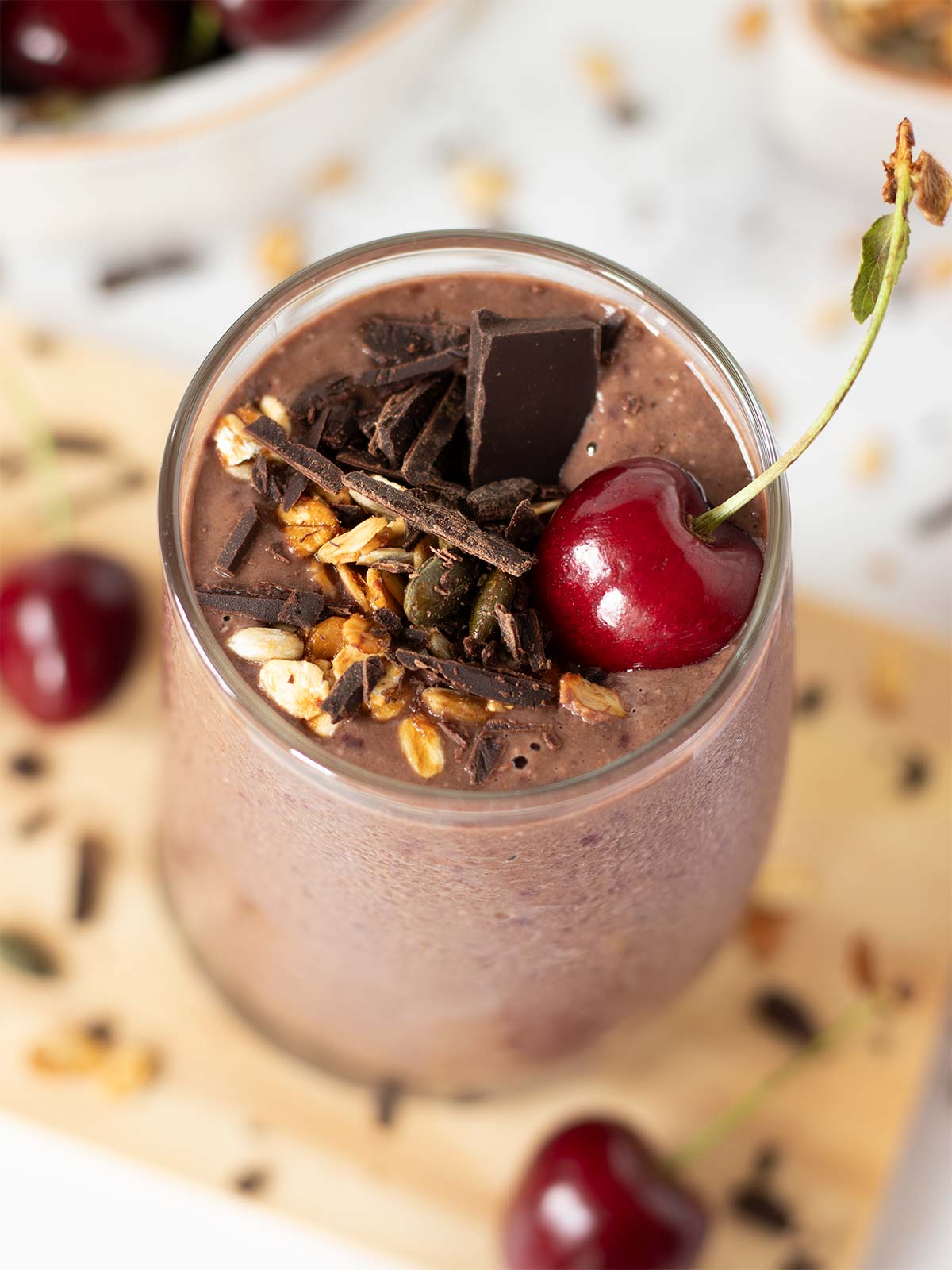Chocolate cherry oat smoothie with date and peanut butter in a glass