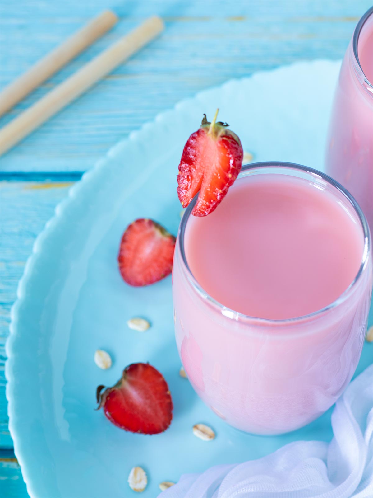 Homemade strawberry oat milk in a glass